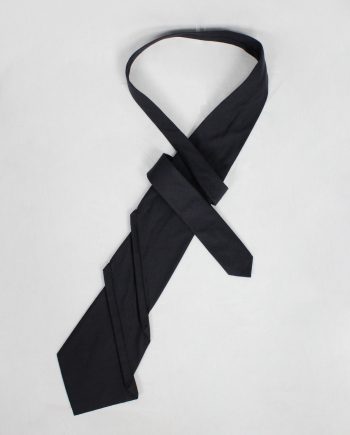 Christophe Coppens dark navy twisted tie, folded diagonally in origami style