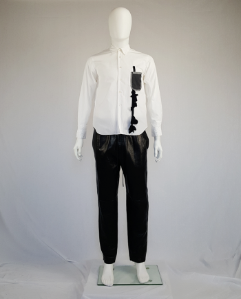 Comme des Garçons Homme Plus white shirt with hanging dolls — spring 2010