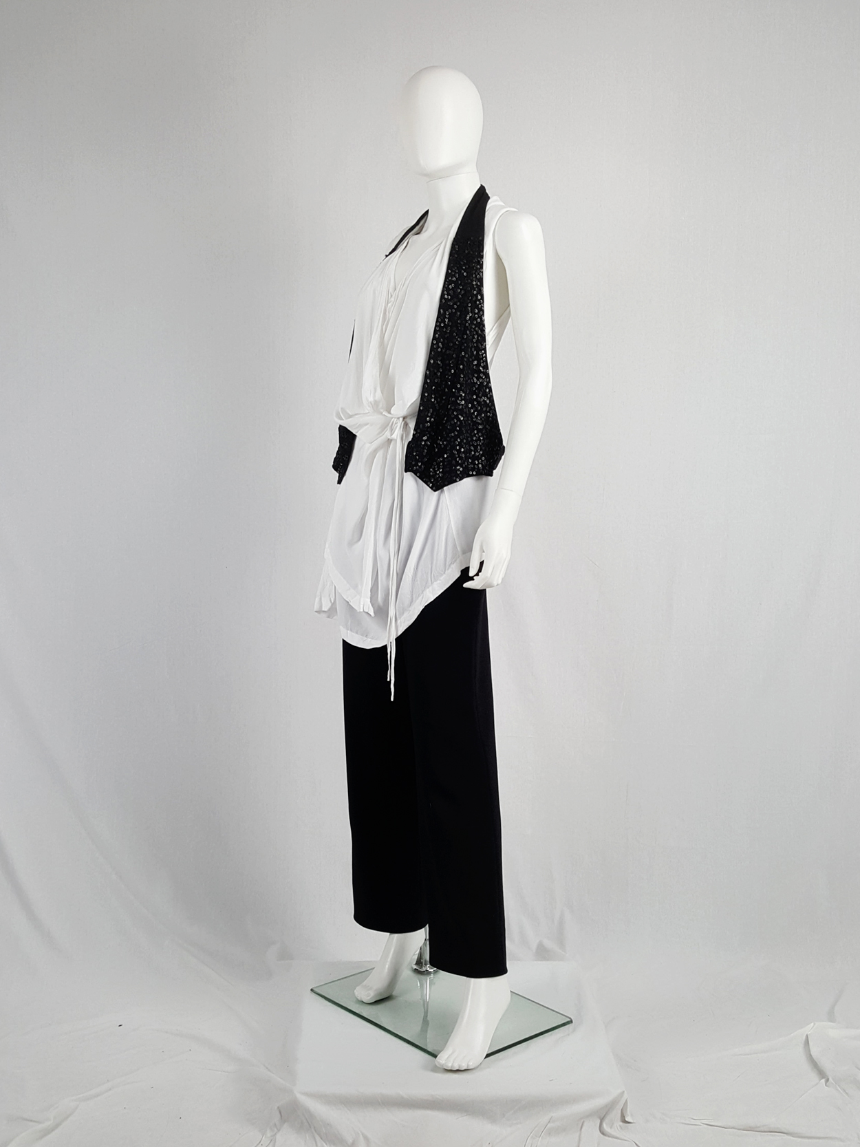 https://www.vaniitas.com/wp-content/uploads/2019/04/vaniitas-vintage-Ann-Demeulemeester-black-backless-waistcoat-with-matte-sequins-spring-2010-114522.jpg