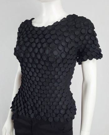 Issey Miyake black t-shirt with the fabric manipulated into 3D circles