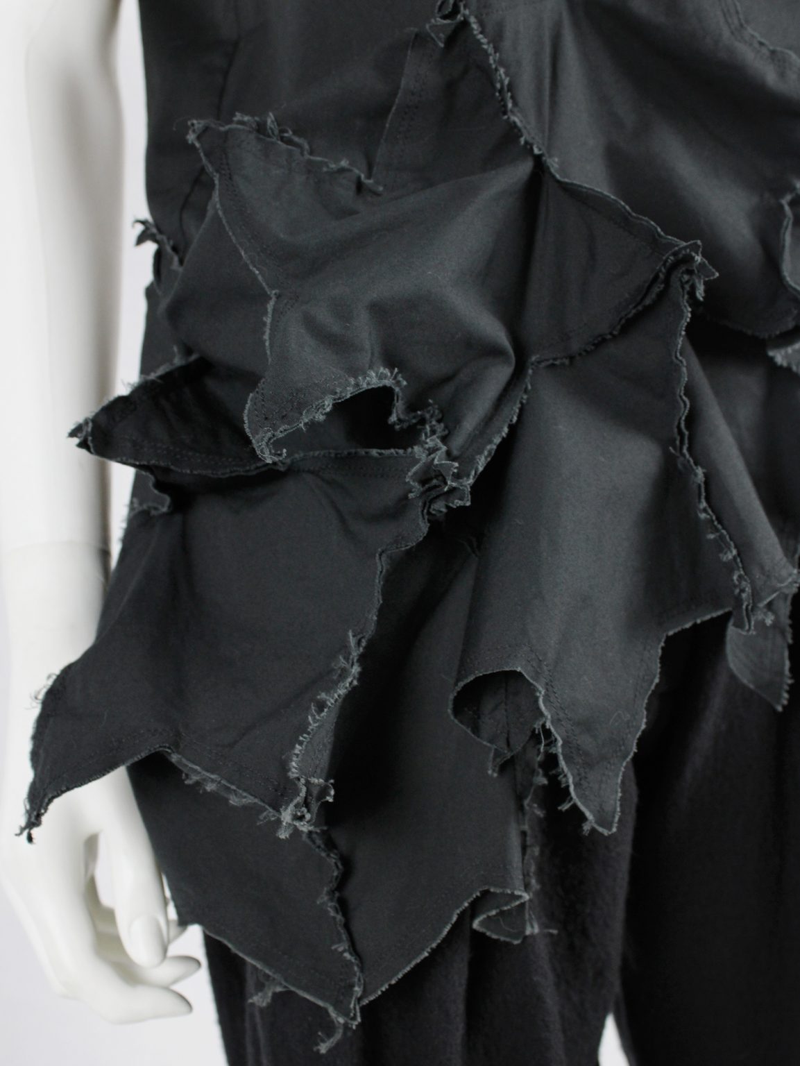 Comme des Garçons black sleeveless top with 3D stars at the hem — AD 2002