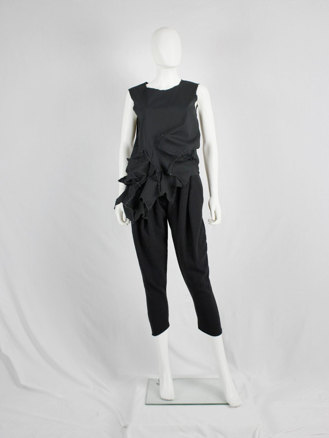 Comme des Garçons black sleeveless top with 3D stars at the hem — AD 2002