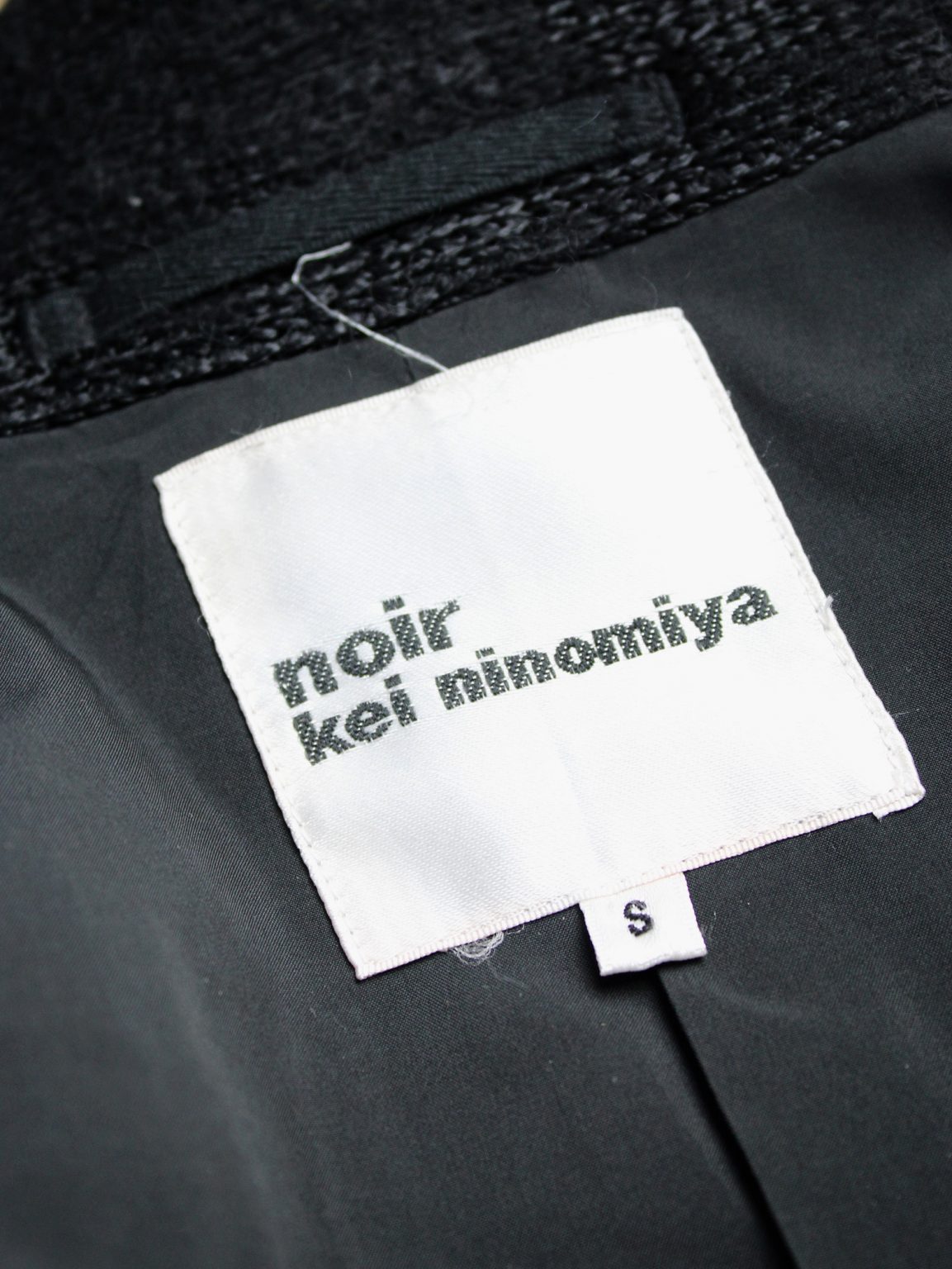 Noir Kei Ninomiya black bicker jacket with textured pied-de-poule motif — spring 2014