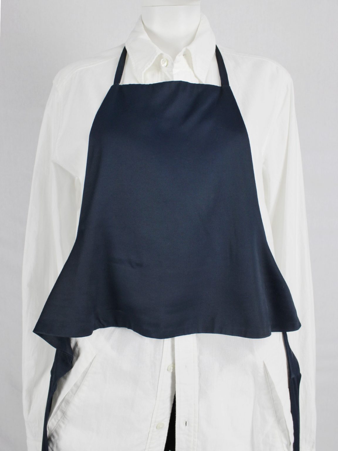 Lieve van gorp dark blue cropped apron with bowtie back — 1990's