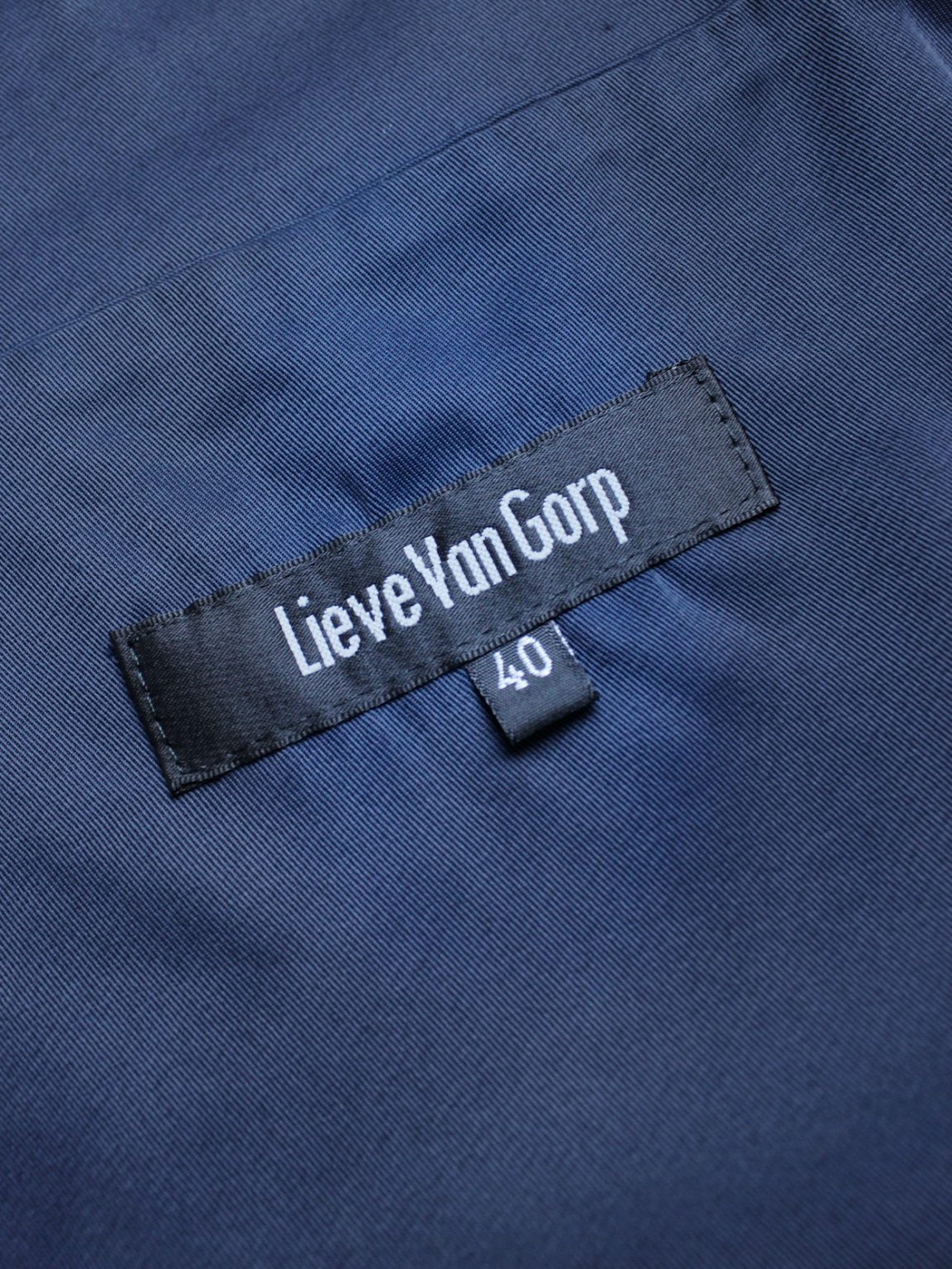 Lieve van gorp dark blue cropped apron with bowtie back — 1990's