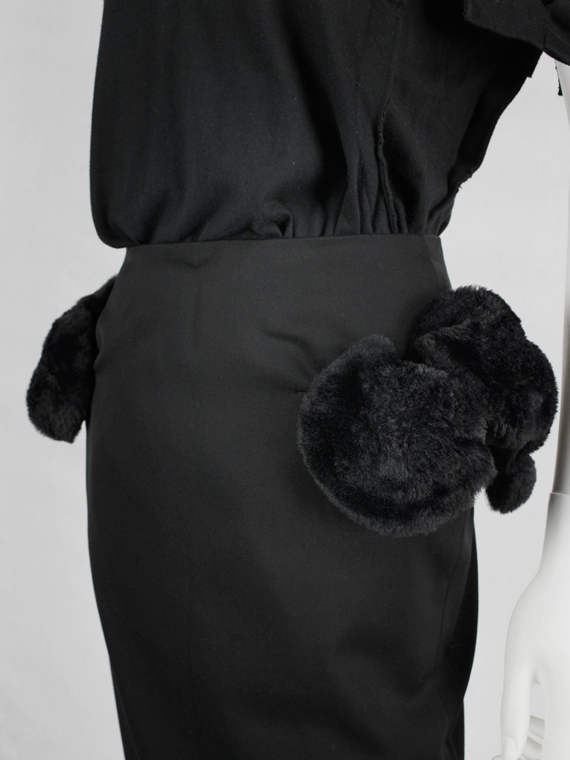 Noir Kei Ninomiya black pencil skirt with furry puffballs on the hips — fall 2016