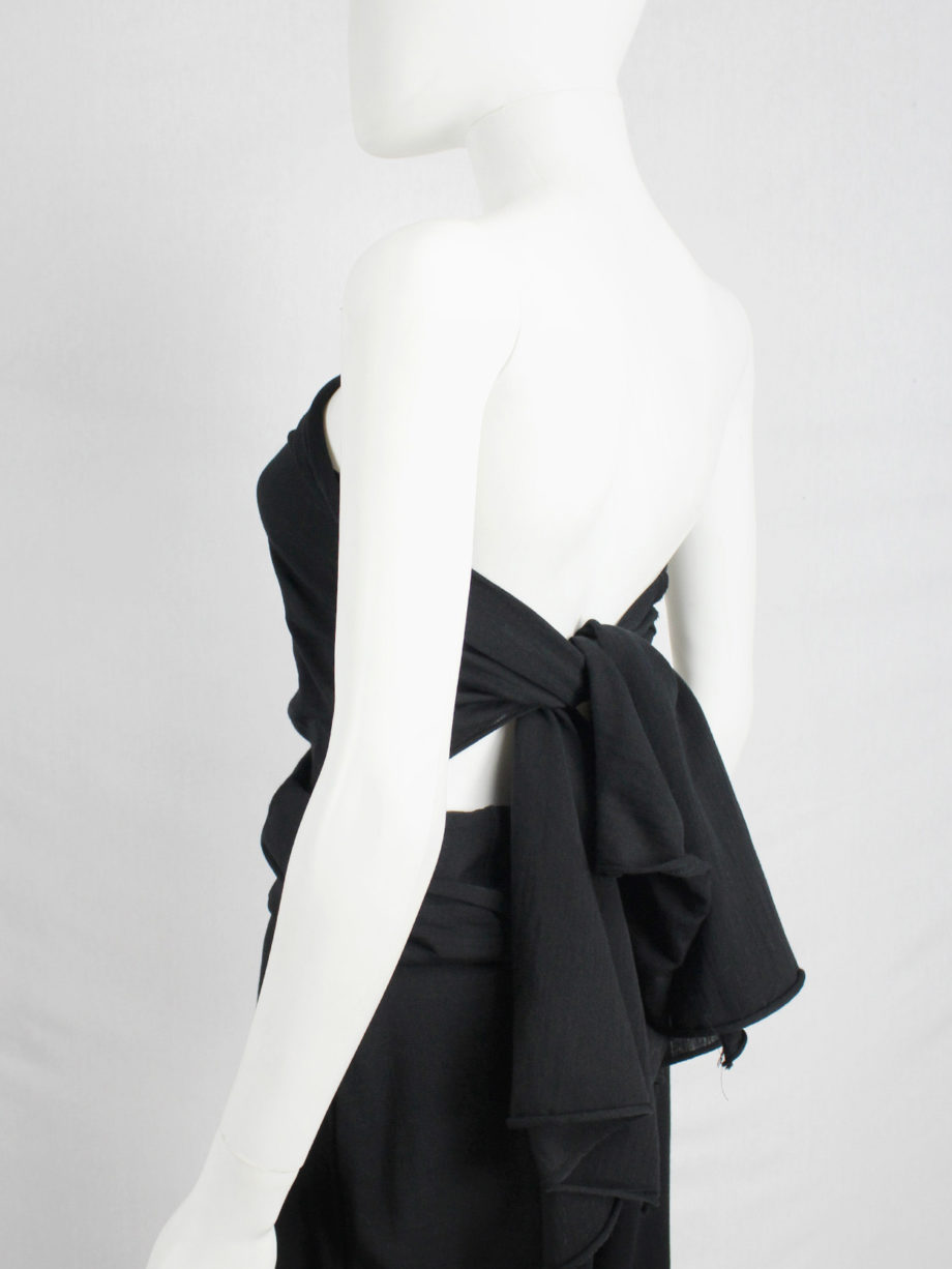 Comme des Garçons black jumpsuit with cape or bow at the back — AD 1994