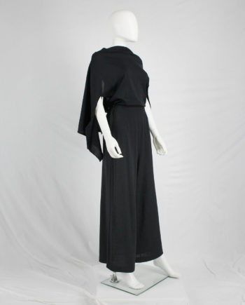 Comme des Garçons black jumpsuit with cape or bow at the back — AD 1994