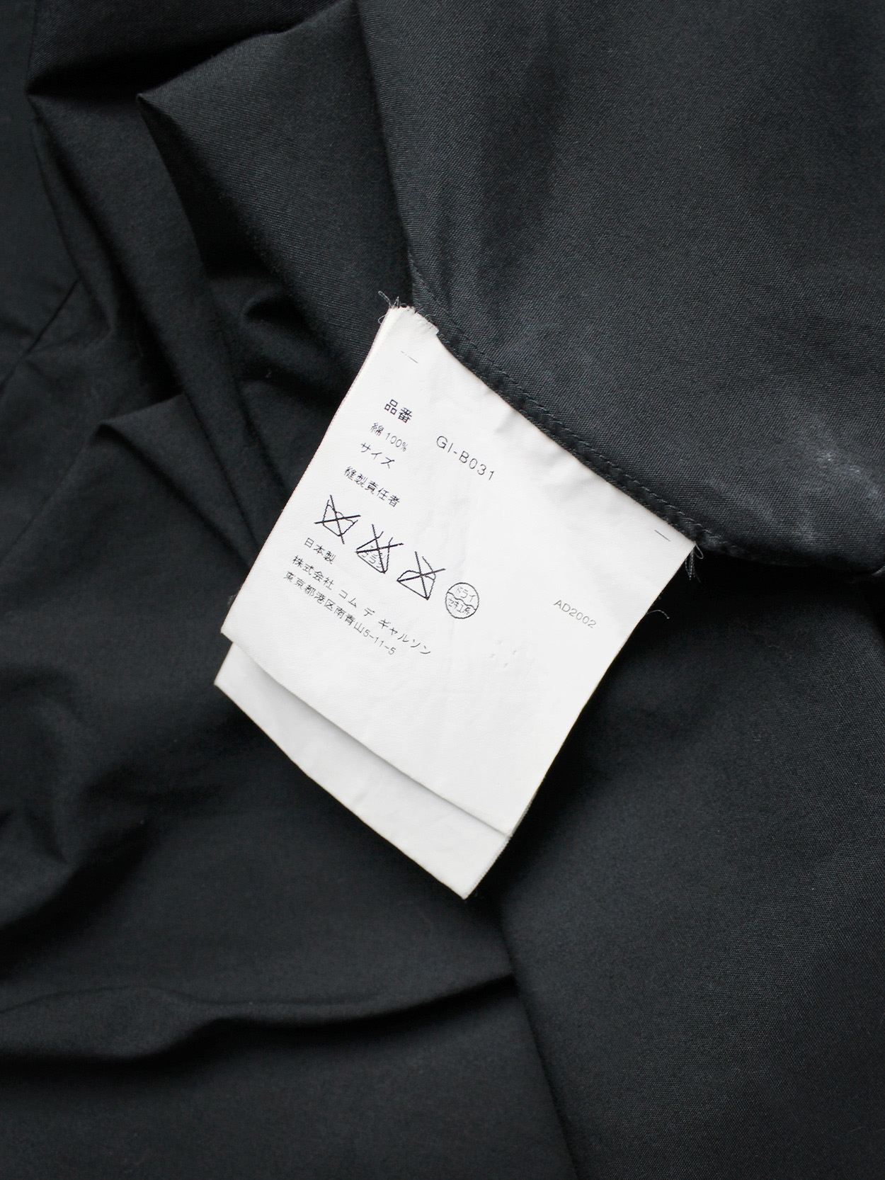 Comme des Garçons black shirt with slits and three bows — spring 2002 ...
