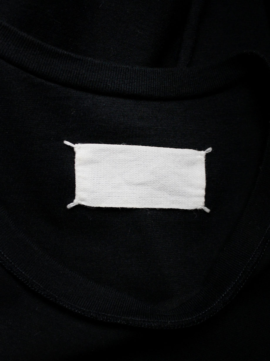Maison Martin Margiela black t-shirt hanging on the front of the body — spring 2003