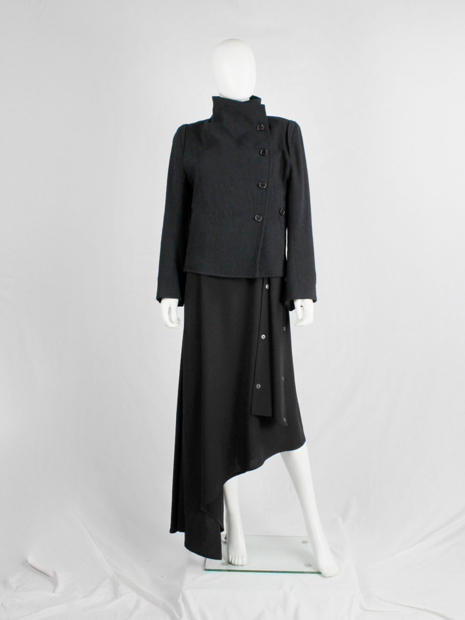 Ann Demeulemeester black coat with standing neckline and asymmetric button closure — fall 2010