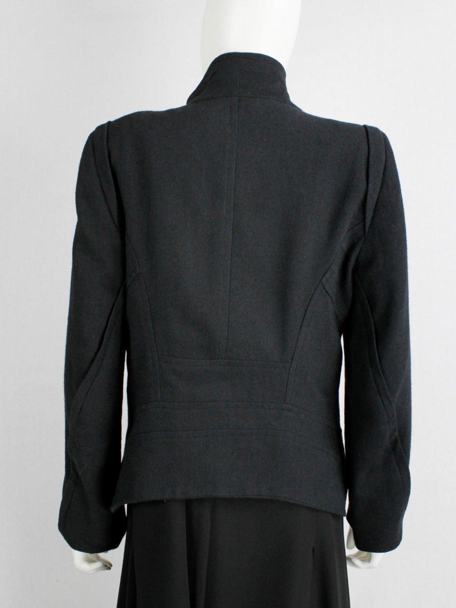 Ann Demeulemeester black coat with standing neckline and asymmetric button closure fall 2010 (19)