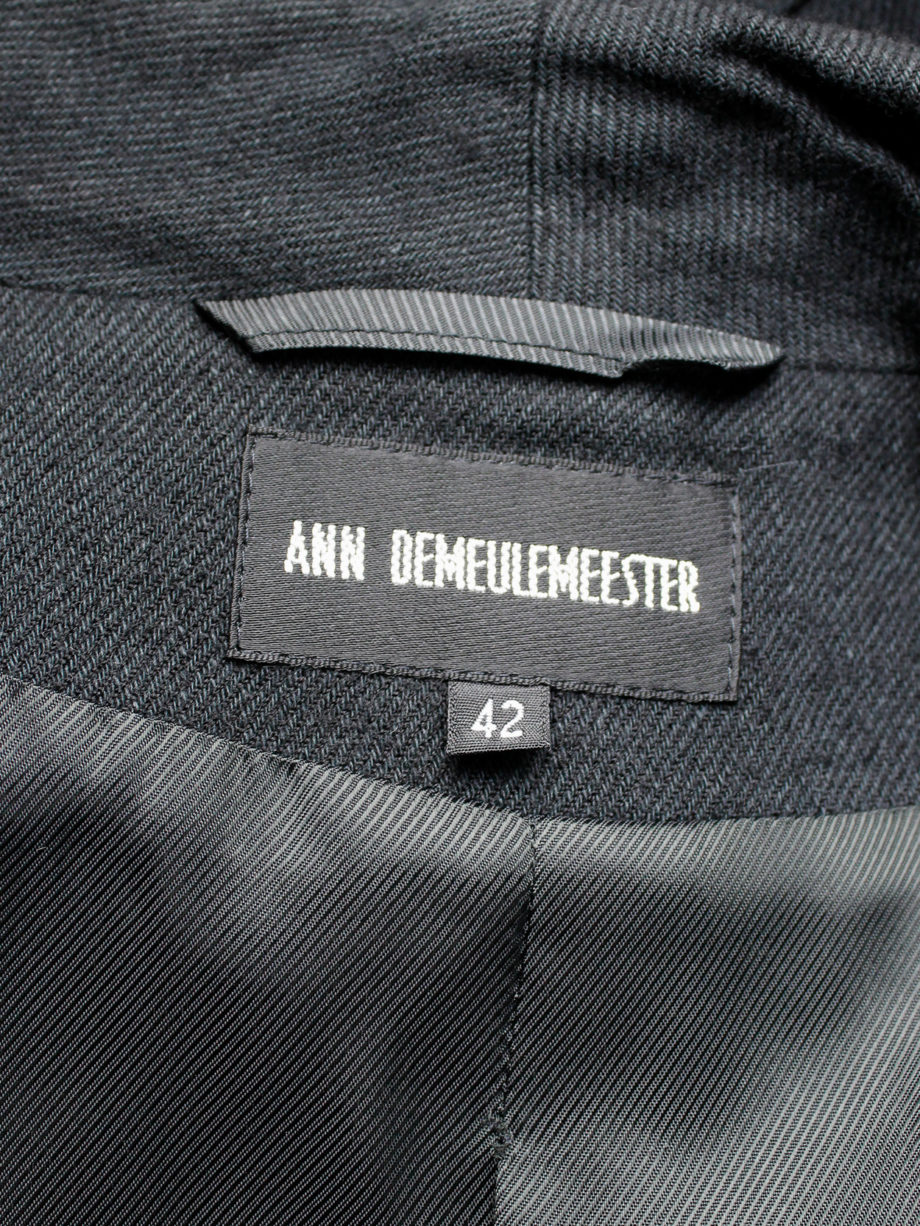 Ann Demeulemeester black coat with standing neckline and asymmetric button closure fall 2010 (4)