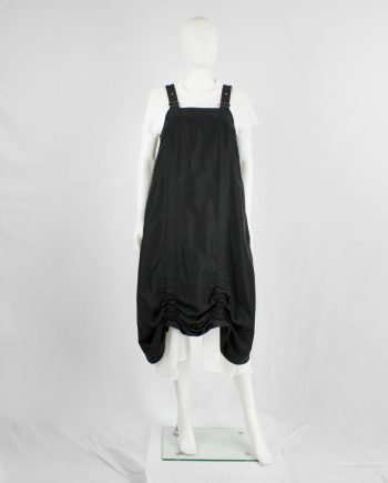 Noir Kei Ninomiya black salopette dress with belt straps and scrunched hem — spring 2019