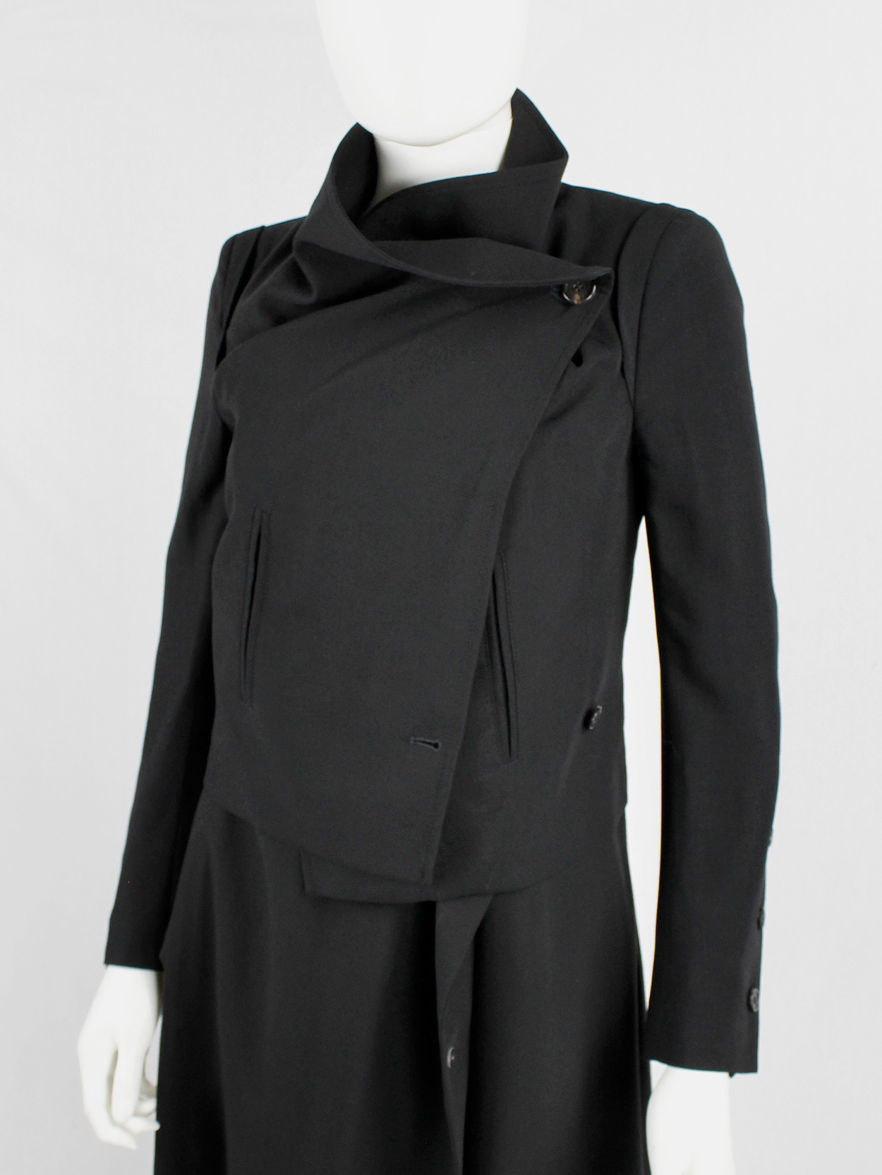 Ann Demeulemeester black jacket with buttons twisting around the ...