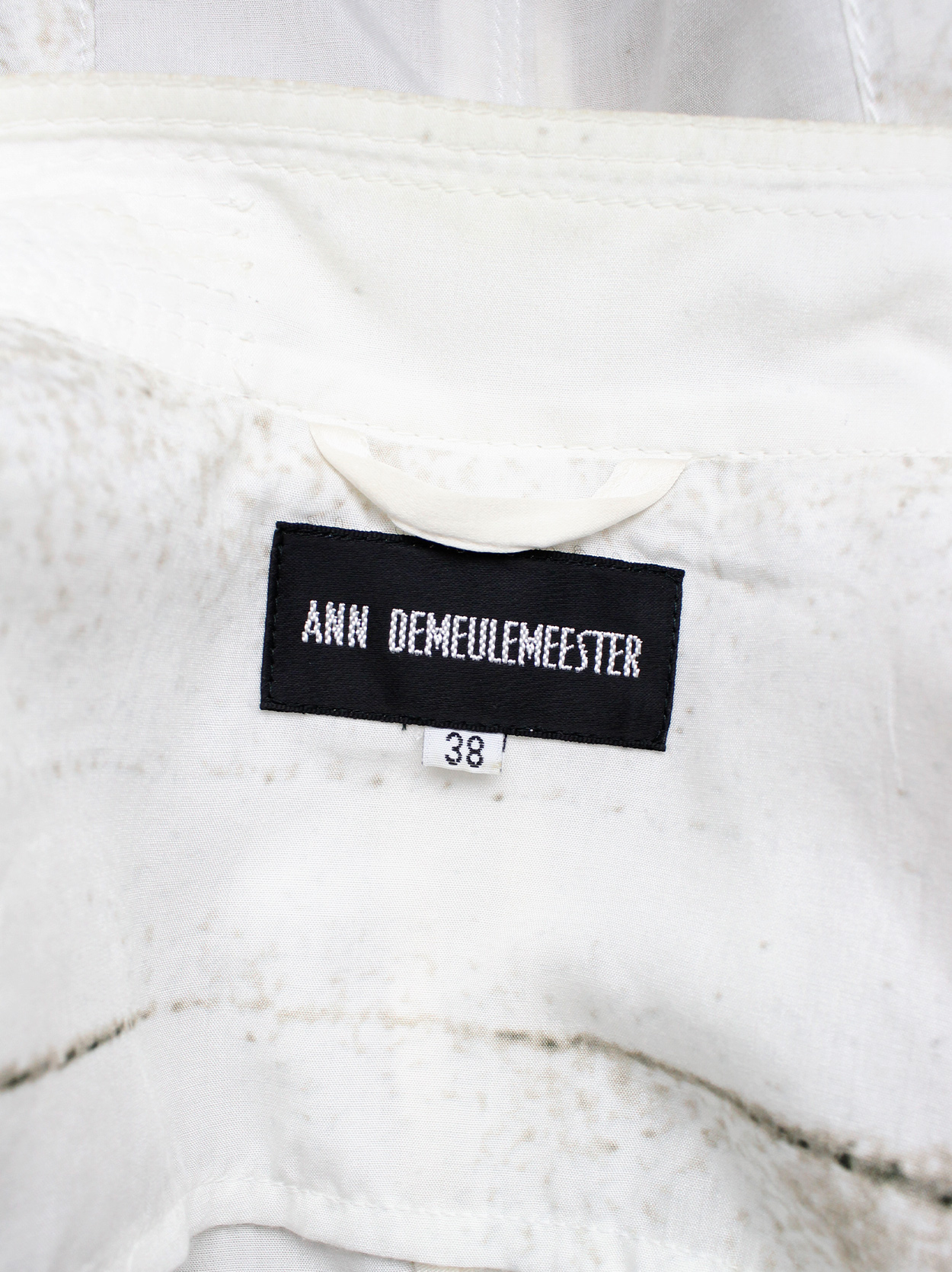 Ann Demeulemeester white buttoned fencing jacket with stitched panels ...