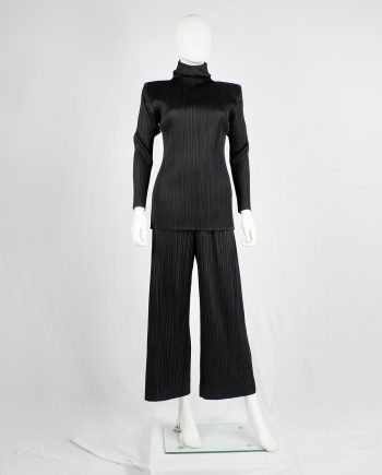 Issey Miyake Pleats Please black pleated trousers with wide legs and fake button closure