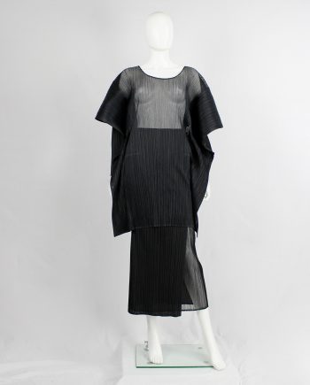 Issey Miyake Pleats Please black square jumper buttoned into a folded cardigan