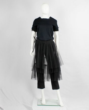 Comme des Garçons black trousers with tiered tulle half-skirt — fall 2004