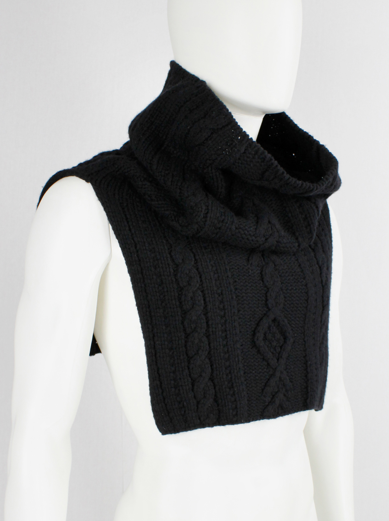 https://www.vaniitas.com/wp-content/uploads/2022/02/vintage-Yohji-Yamamoto-black-knit-poncho-scarf-with-oversized-turtleneck-collar-2.jpg