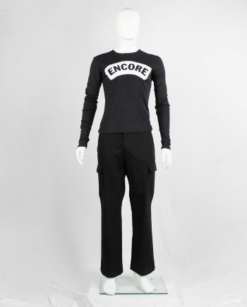 Xavier Delcour black jumper with white 'Encore' patch printed across the chest — fall 2003