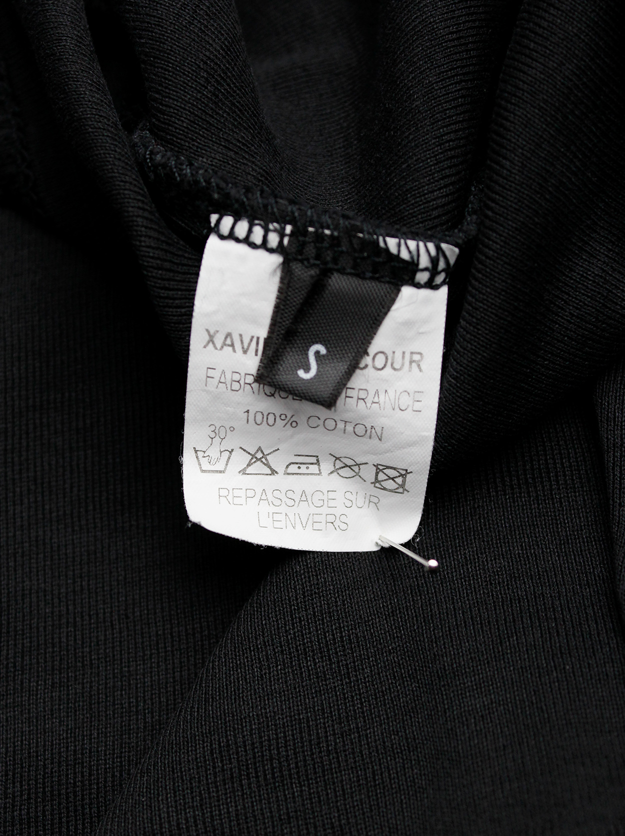 Xavier Delcour black jumper with white 'Encore' patch printed across ...