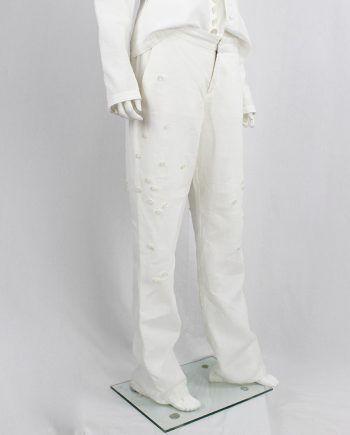 Dirk Bikkembergs white trousers decorated with buttons on the side spring 2005