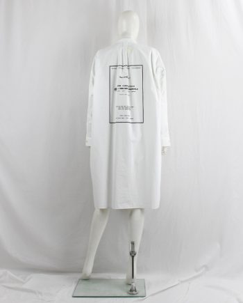 Maison Margiela MM6 white raincoat-style oversized shirt dress with 6-line history print — pre-fall 2018