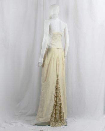 Kaat Tilley pastel yellow maxi skirt with curved stitching and multi-tiered train