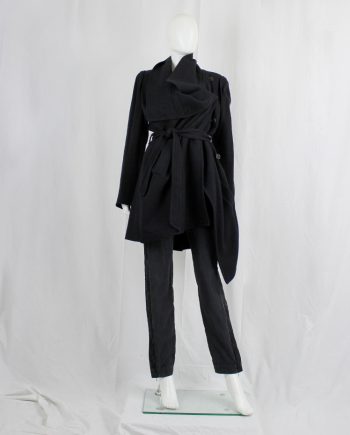 Ann Demeulemeester black coat with large standing neckline and asymmetric button closure — fall 2010